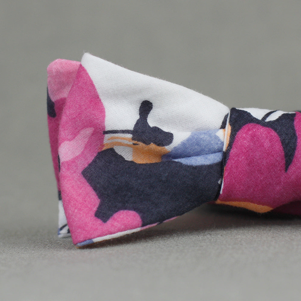bright floral bow tie in navy, magenta, peach, coral, periwinkle, & white